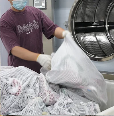 Place in a shoe washing machine for cleaning.