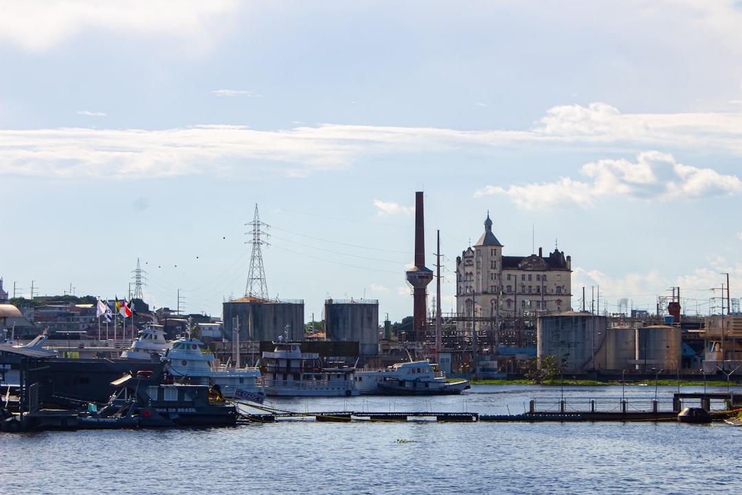 Busy American shipping port with cargo ships and industrial infrastructure enabling export of used clothing and bales from us bales suppliers