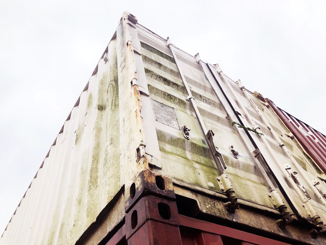 Shipping containers at a port, representing the global logistics network for wholesale second hand clothing exports