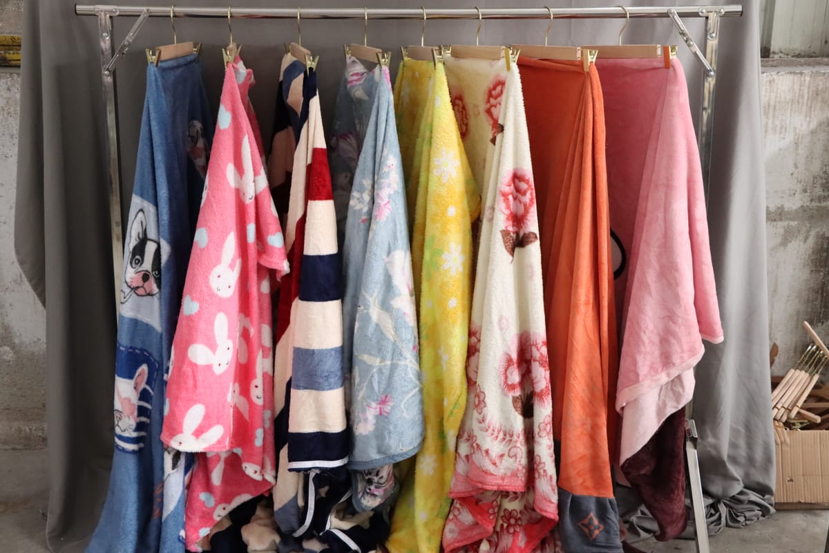 Weight comparison — pieces per kilogram of used clothing by category and origin