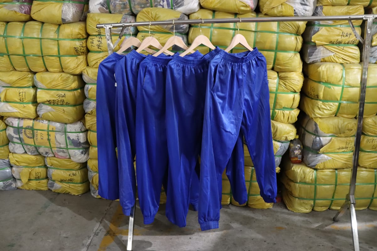 School uniform bales — category-specific sorted bales versus unsorted mixed bales
