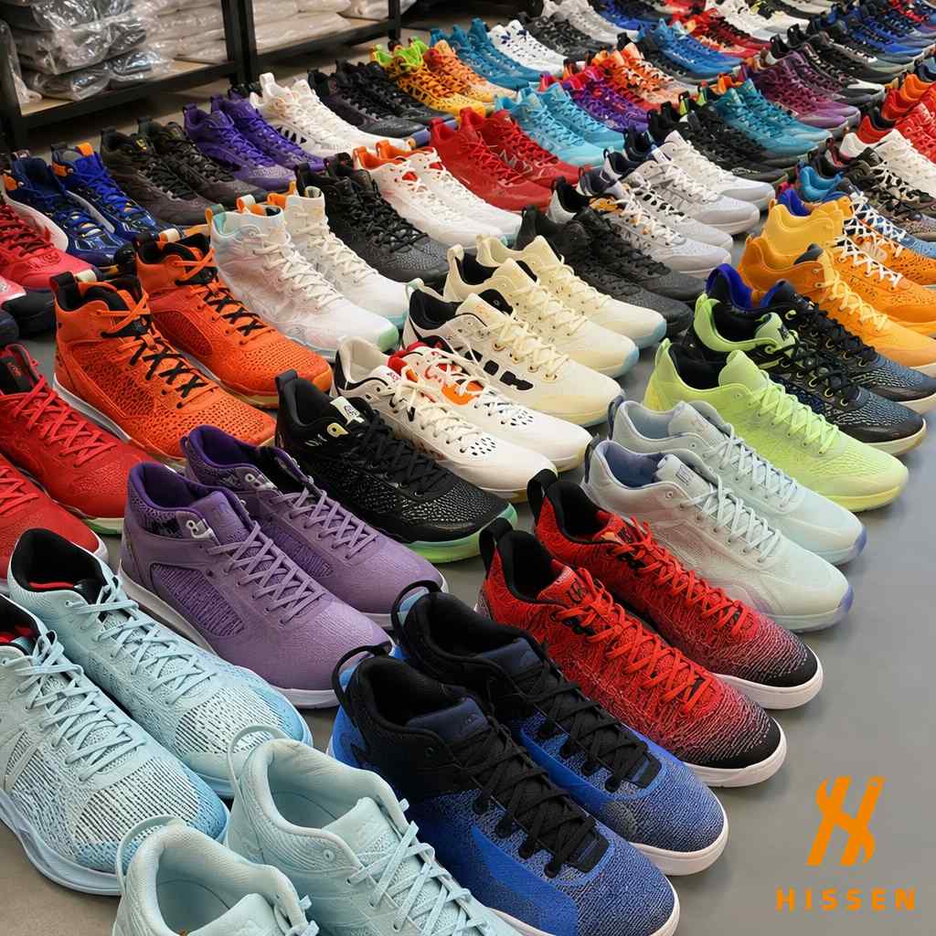 Collection of 361 basketball and performance running shoes lined up for inspection