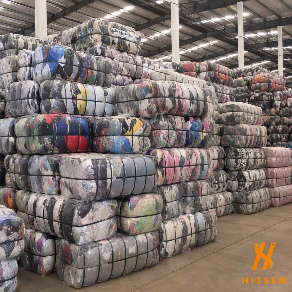Professional wholesale supplier warehouse with used clothing bales stacked for export