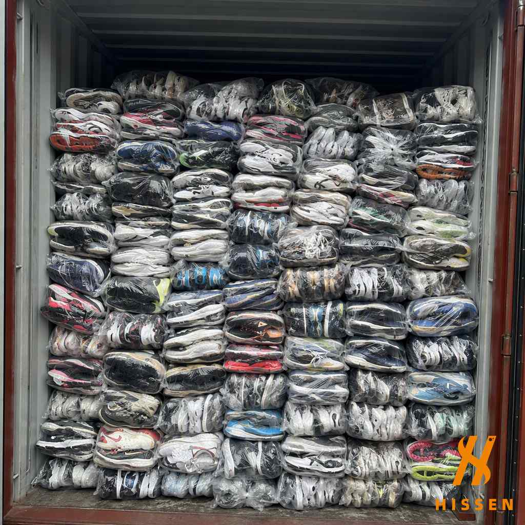 Bulk export container loaded with mixed brand second hand sneakers
